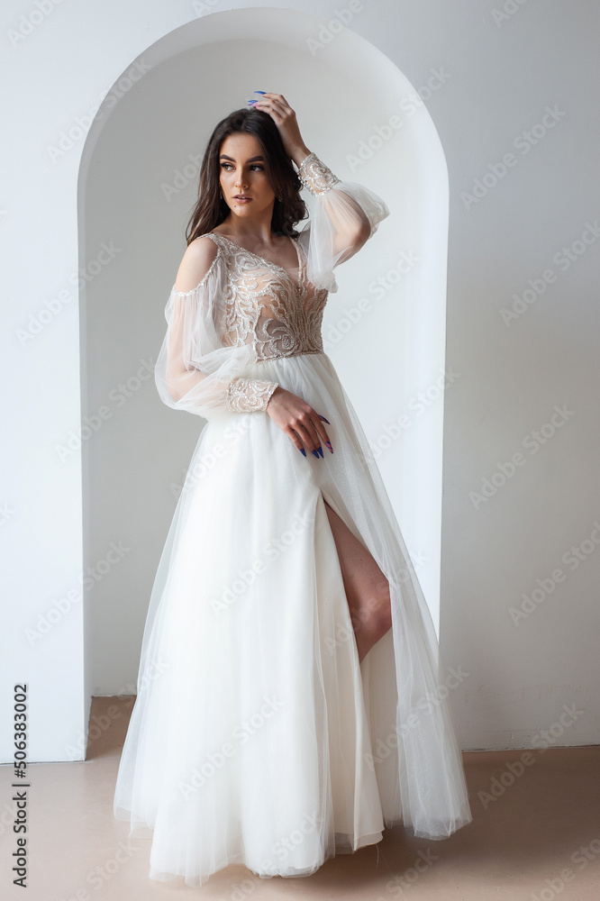 Beautiful bride perfect style. Wedding hairstyle make-up luxury wedding dress Beautiful bride perfect style. Wedding hairstyle make-up luxury wedding dress