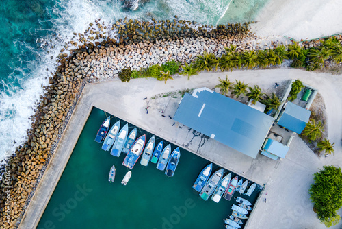 Aerial view of boat jetty at Fuvahmulah Harbour, fishing port and famous dive site for tiger sharks, Fuvahmulah Island, Gnaviyani Atoll or Nyaviyani Atoll, Maldives photo