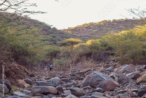 Rear view of hikers in the mountains in Makueni, Kenya photo