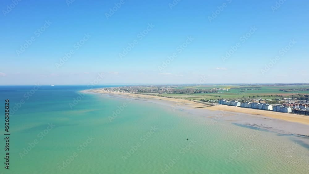 The Channel Sea in front of the fine sand beach of Juno beach in Europe, in France, in Normandy, towards Arromanches, in Berniere sur Mer, in spring, on a sunny day. The Channel Sea in front of the fine sand beach of Juno beach in Europe, in France, in Normandy, towards Arromanches, in Berniere sur Mer, in spring, on a sunny day.