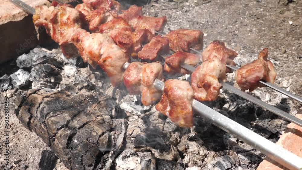 Cooking meat skewers on an open fire. Summer vacation outside the city. Cooking meat skewers on an open fire. Summer vacation outside the city.