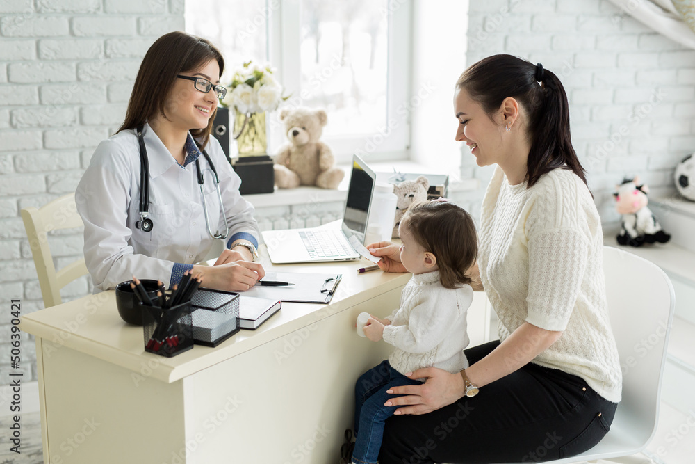 Pediatrician Meeting With Mother And Child In Hospital Pediatrician Meeting With Mother And Child In Hospital