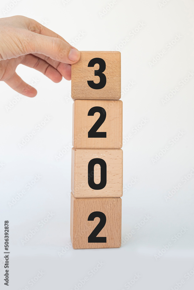 woman hand forming 2023 with cube blocks.new business goal strategy concept. 2023 goal planning business concept woman hand forming 2023 with cube blocks.new business goal strategy concept. 2023 goal planning business concept