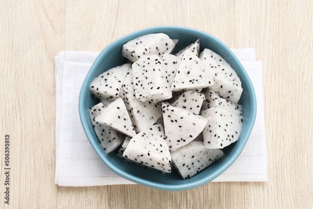 A bowl of fresh dragon fruit served on bowl on wooden background. Breakfast fruit in the morning. Selected focus image
A bowl of fresh dragon fruit served on bowl on wooden background. Breakfast fruit in the morning. Selected focus image