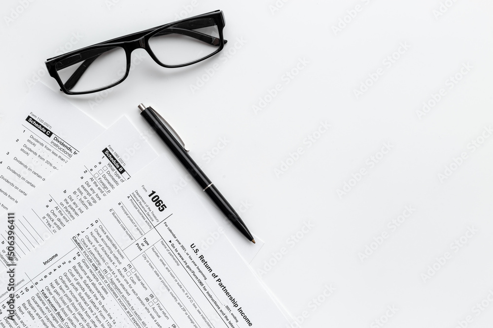 Pen on US individual tax form. Tax payment season Pen on US individual tax form. Tax payment season