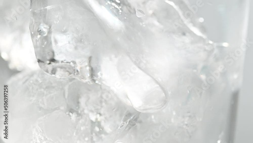 Pouring melon soda juice into glass with ice