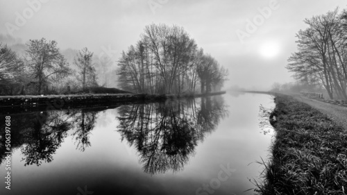 Foggy morning on the canal of the Loing river in the French Gatinais Regional Nature Park