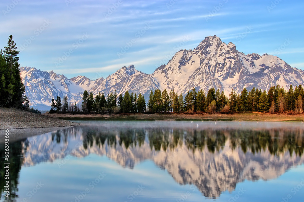 The Grand Teton Mountain view at the waters of Colter Bay, inside the Grand Teton National Park, Wyoming, USA
