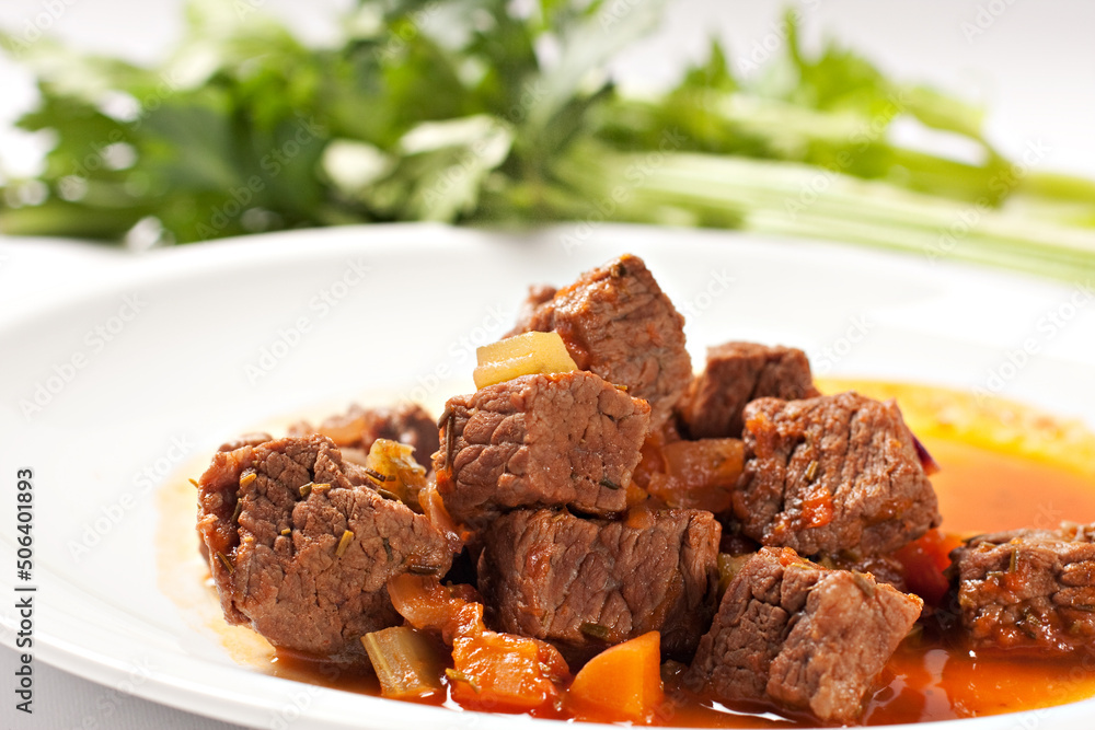Hot beef stew on a plate. High quality photo. Hot beef stew on a plate. High quality photo.