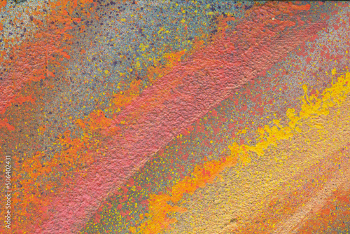Texture. Yellow and orange strokes of paint. Abstraction. Plaster. High quality photo.