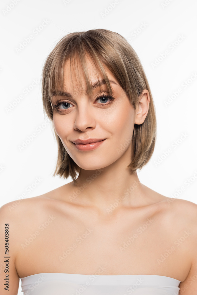 cheerful young woman with bare shoulders looking at camera isolated on white cheerful young woman with bare shoulders looking at camera isolated on white