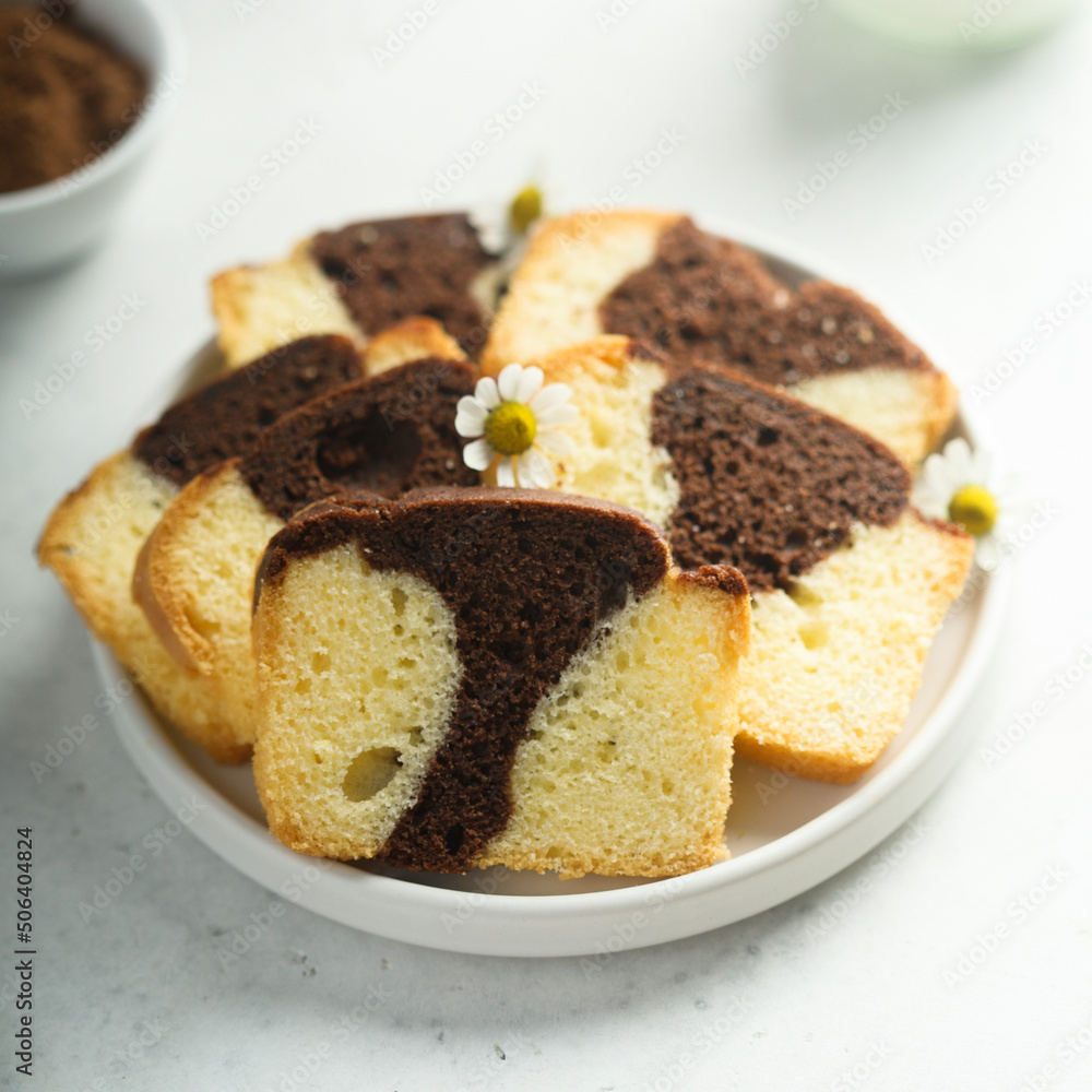 Homemade vanilla chocolate marbled cake on a plate Homemade vanilla chocolate marbled cake on a plate