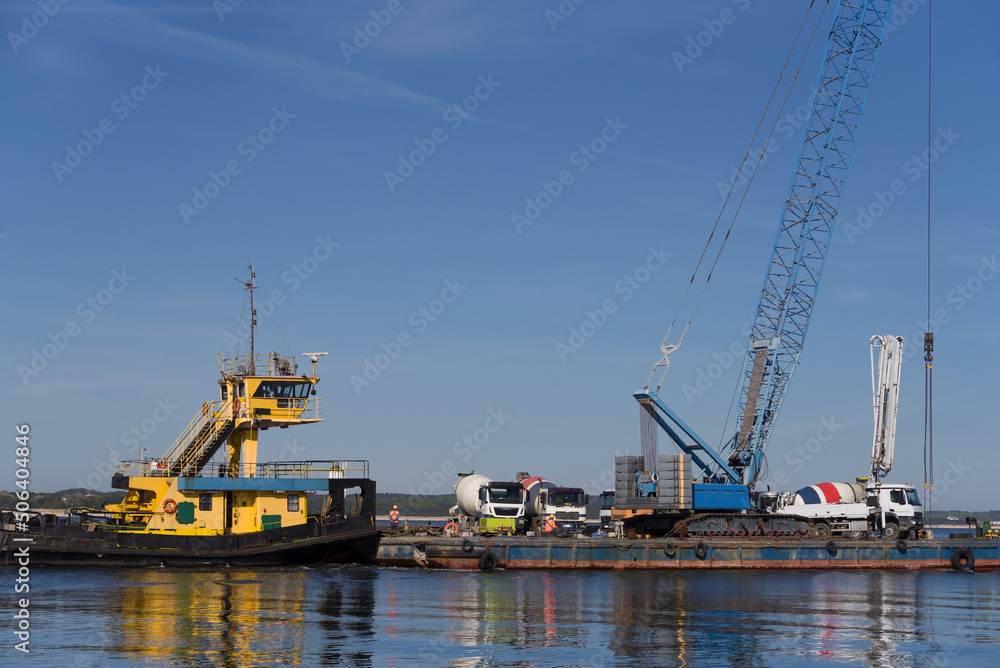 PUSHER TUG AND BARGE - A floating platform with crane for hydrotechnical works and concrete mixer trucks on deck
