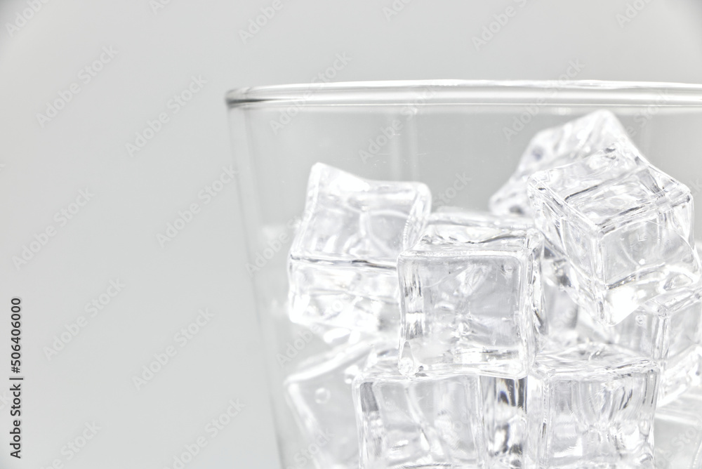 Ice in glass closeup on a white background. Ice in glass closeup on a white background.