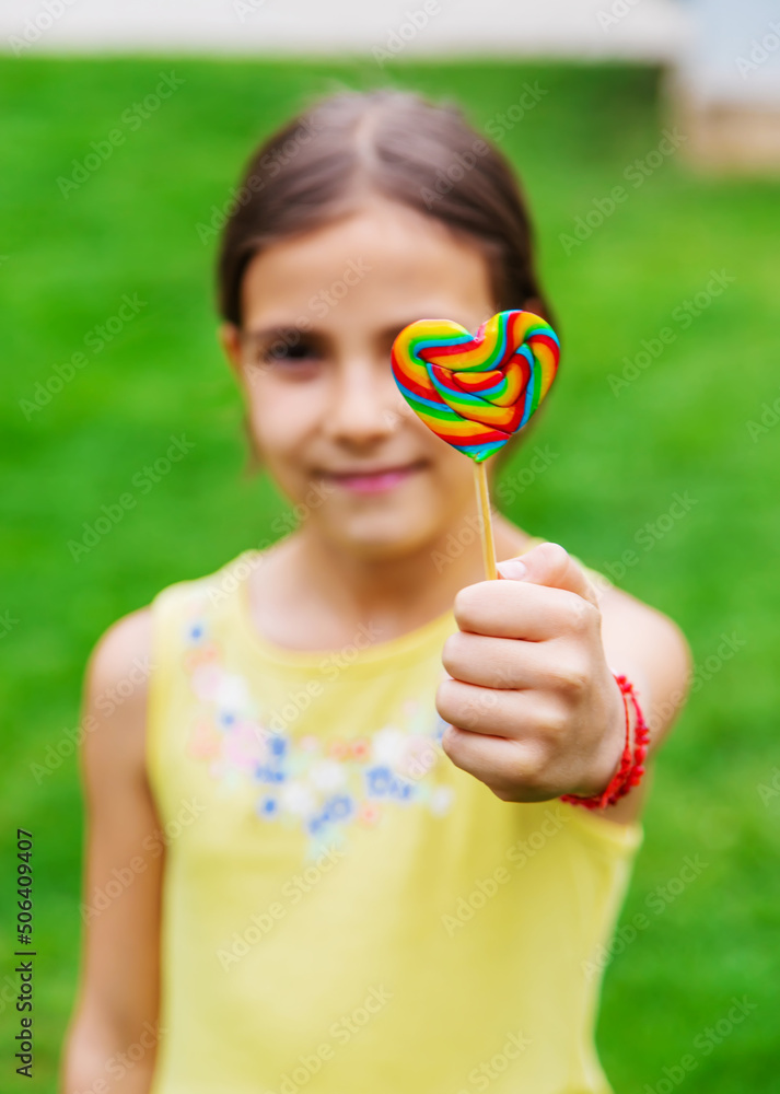 Lollipops in the hands of children. Selective focus. Lollipops in the hands of children. Selective focus.
