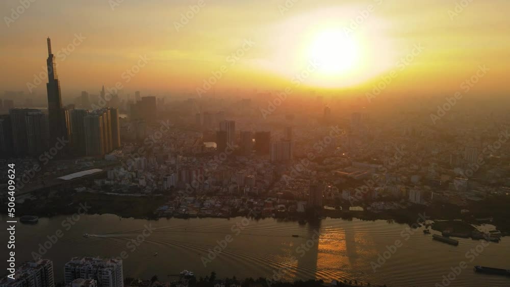 Aerial Drone in 4k over Ho Chi Minh City, Saigon Skyline, Vietnam. Sunset with Landmark 81 and Saigon river. Aerial Drone in 4k over Ho Chi Minh City, Saigon Skyline, Vietnam. Sunset with Landmark 81 and Saigon river.