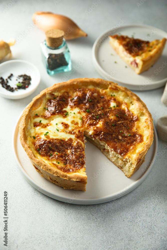 Traditional homemade French quiche with onion and bacon Traditional homemade French quiche with onion and bacon