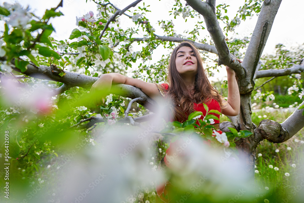 Young woman in apple orchard in indian costume Young woman in apple orchard in indian costume