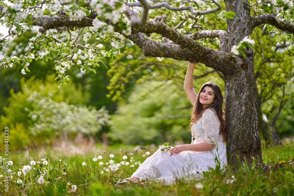 Young woman in apple orchard Young woman in apple orchard