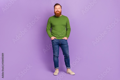 Full size portrait of satisfied glad young person put hands pockets isolated on purple color background