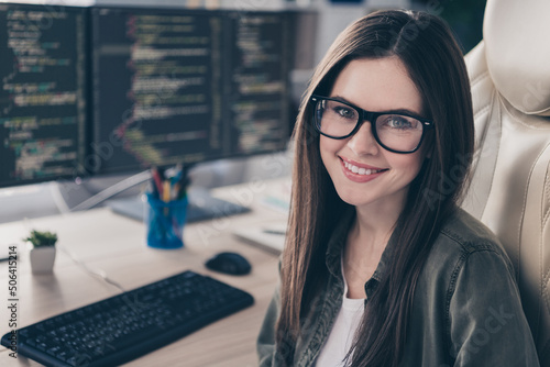 Free Download Portrait of attractive cheerful experienced girl database editor developing web data at workplace workstation indoors - GFXLoad