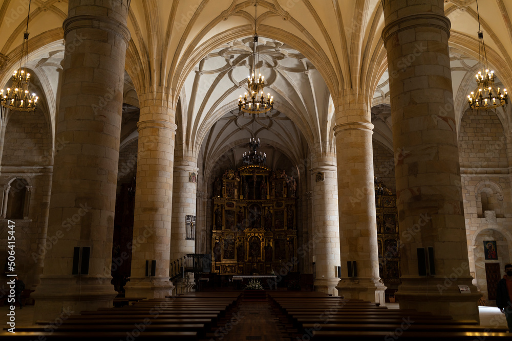 Interior of the Cathedral of San Pedro de Soria, in Renaissance Romanesque style, with its columns, arches and the richly decorated apse in the background