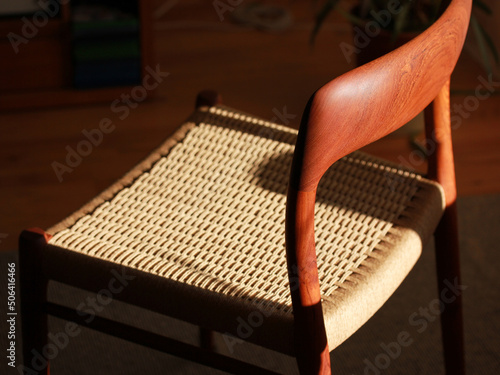 Bild auf Leinwand A danish mid century modern teak chair from the 60s vintage standing in the dini