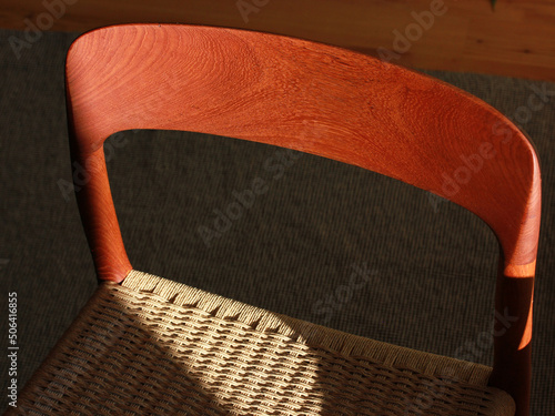 Fotografie A danish mid century modern teak chair from the 60s vintage standing in the dini