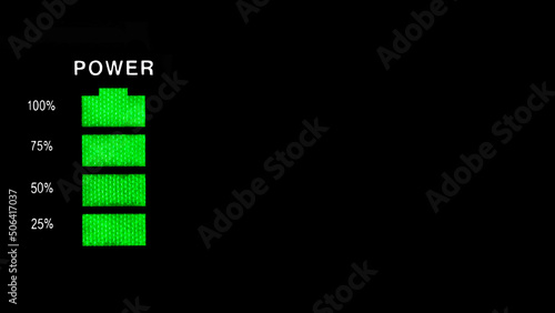 Battery charging indication in green minimalism on a black background