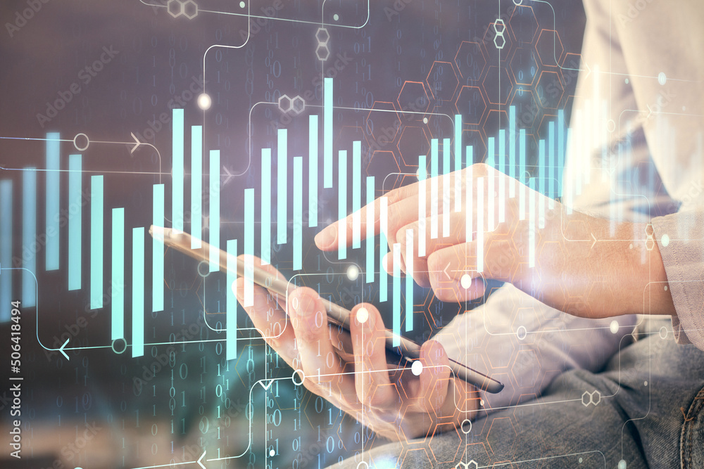 Double exposure of man's hands holding and using a digital device and forex graph drawing. Financial market concept. Double exposure of man's hands holding and using a digital device and forex graph drawing. Financial market concept.