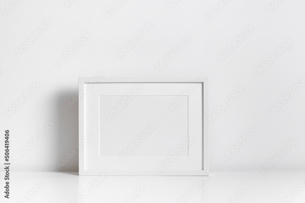 White frame mockup in minimalistic room interior White frame mockup in minimalistic room interior