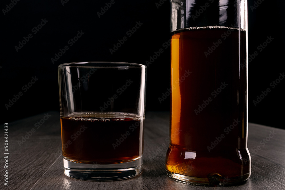 Glass cup with alcoholic drinks in hand. Glass cup with alcoholic drinks in hand.