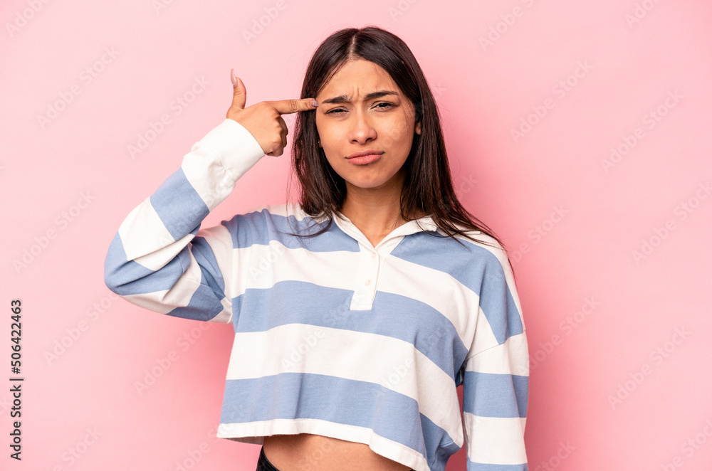 Young hispanic woman isolated on pink background covering ears with hands. Young hispanic woman isolated on pink background covering ears with hands.