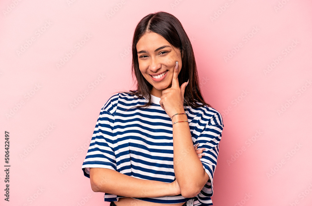 Young hispanic woman isolated on pink background smiling happy and confident, touching chin with hand. Young hispanic woman isolated on pink background smiling happy and confident, touching chin with hand.