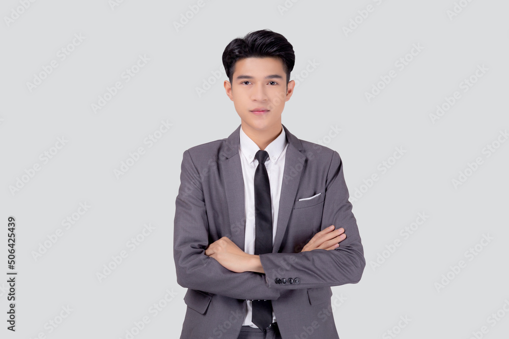 Portrait businessman in suit with crossed his arms standing isolated on white background, young asian business man is manager or executive having confident is positive with success.