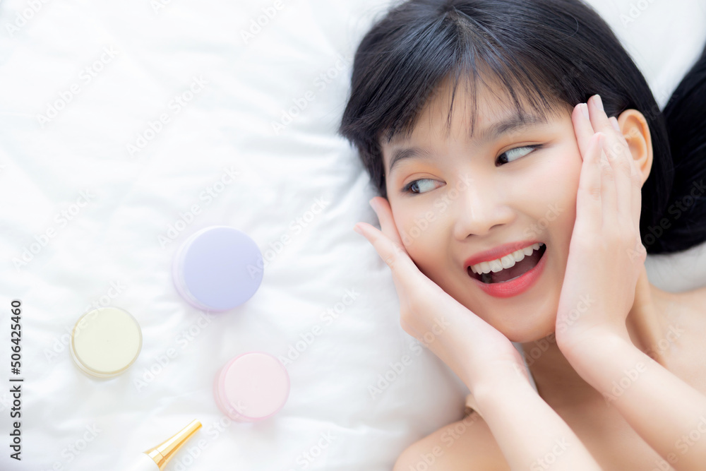Beautiful of young asian woman smiling and lying on bed with cosmetic at bedroom, beauty of girl with hygiene and healthy, cream and lotion and skin care, top view, skincare and lifestyles concepts. Beautiful of young asian woman smiling and lying on bed with cosmetic at bedroom, beauty of girl with hygiene and healthy, cream and lotion and skin care, top view, skincare and lifestyles concepts.