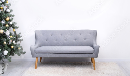 Canvas Print Minimalist light room interior with couch and christmas tree