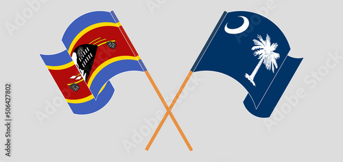 Crossed and waving flags of Eswatini and The State of South Carolina