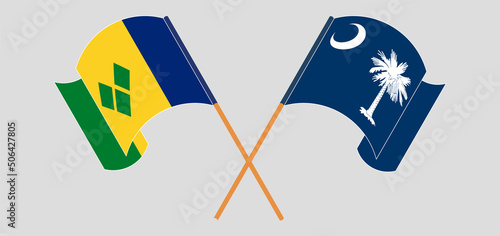 Crossed and waving flags of Saint Vincent and the Grenadines and The State of South Carolina