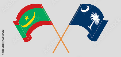 Crossed and waving flags of Mauritania and The State of South Carolina