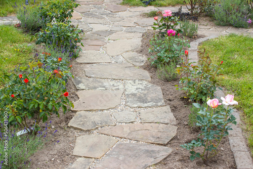  stone paved garden path and flowers