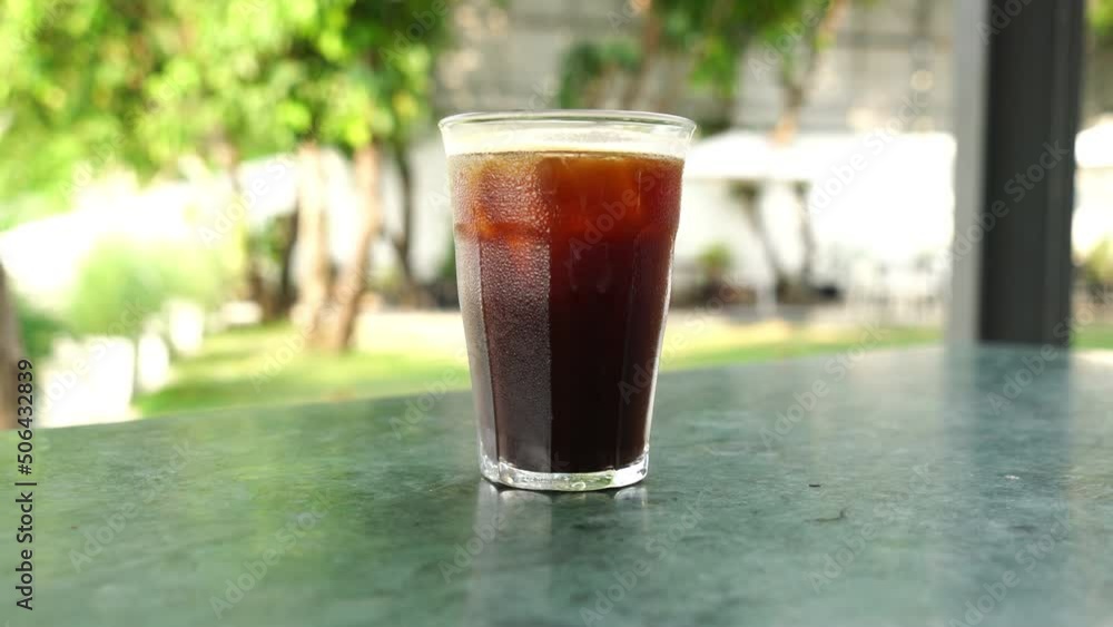 iced americano coffee glass on table in coffee shop cafe and restaurant iced americano coffee glass on table in coffee shop cafe and restaurant