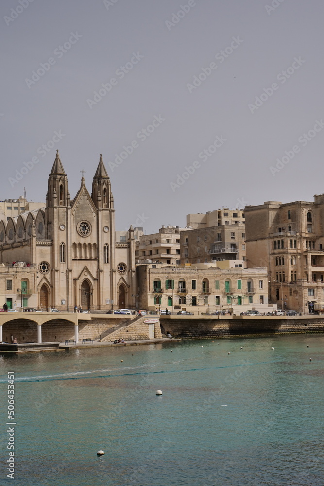 skyline of St Julians, Malta with the knisja tal-karmnu church on a sunny day