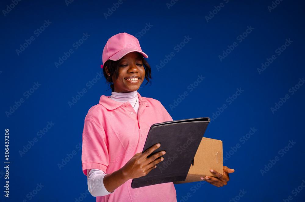 Portrait of Happy African American delivery woman holding a box package Portrait of Happy African American delivery woman holding a box package