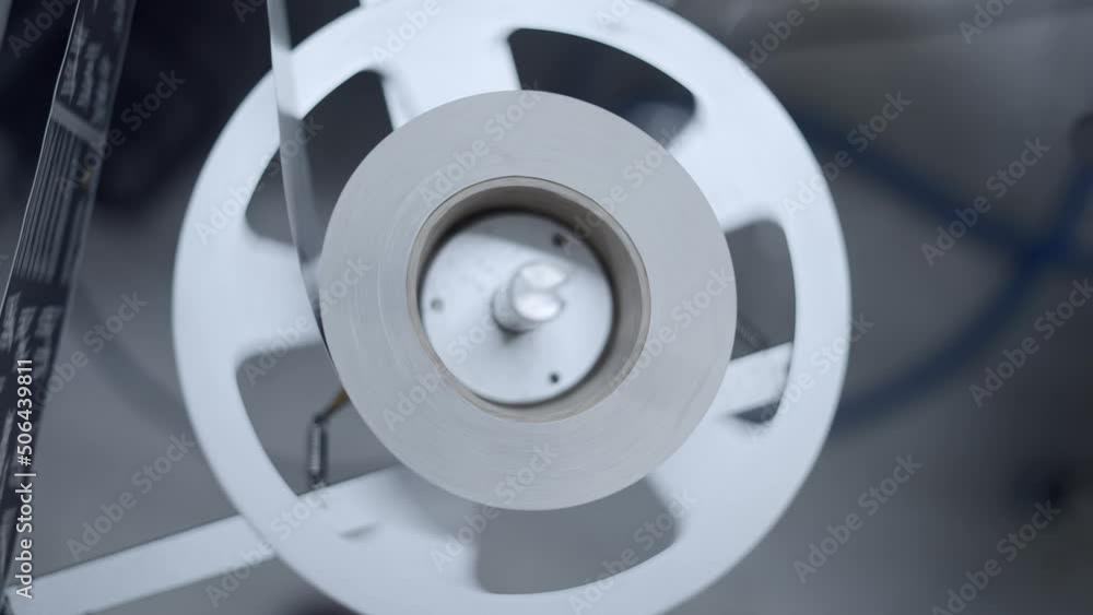 Label Plate Rolling During Labeling Of Cans In A Beer Factory. close up Label Plate Rolling During Labeling Of Cans In A Beer Factory. close up