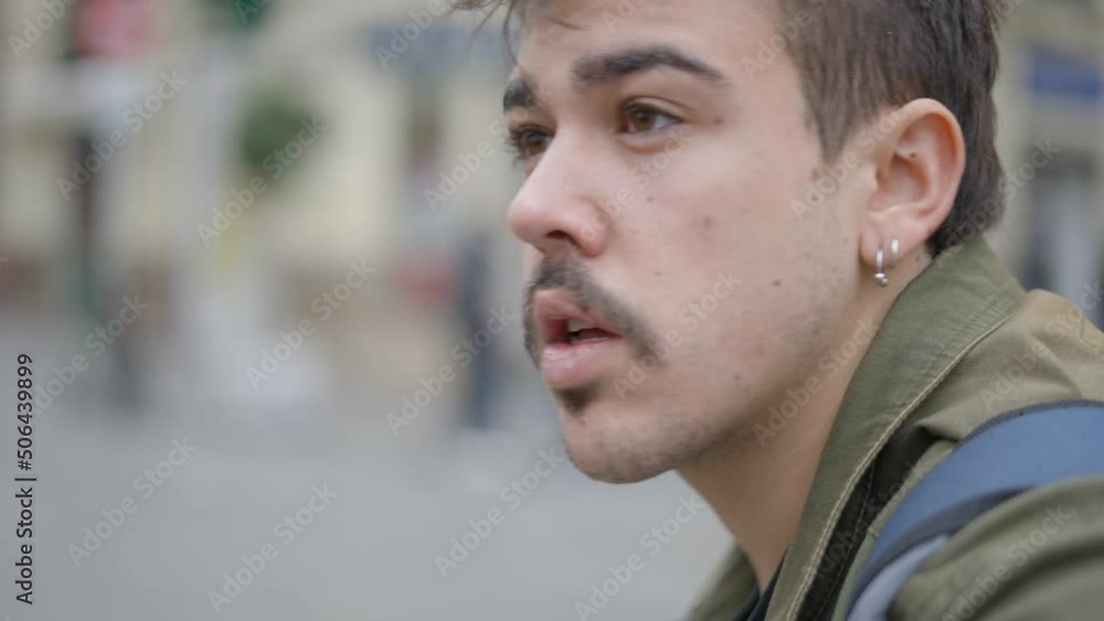 Close up side shot of magician looking for people to show magic tricks in the street. Close up side shot of magician looking for people to show magic tricks in the street.