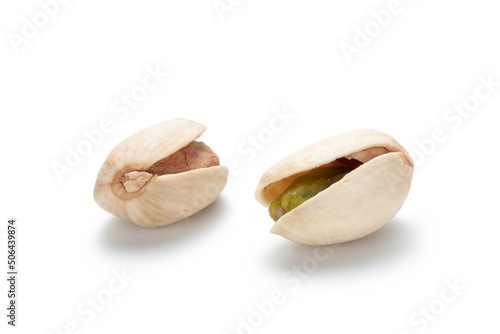 Fresh salted pistachio nuts on white background