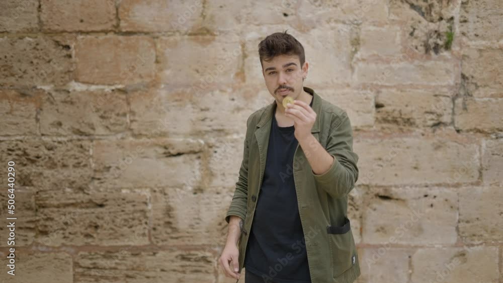 Close-up of Illusionist's hands performing trick with bitcoin.
