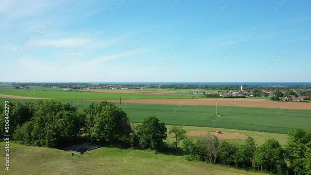 A hedge in the Normandy countryside facing the English Channel in Europe, France, Normandy, towards Arromanches, in summer, on a sunny day. A hedge in the Normandy countryside facing the English Channel in Europe, France, Normandy, towards Arromanches, in summer, on a sunny day.