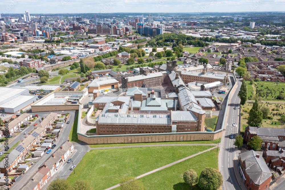 Aerial drone photo of the town of Armley in Leeds West Yorkshire in the UK, showing the famous HM Prison Leeds, or Armley Prison, showing the Jail walls from above on a sunny summers day.